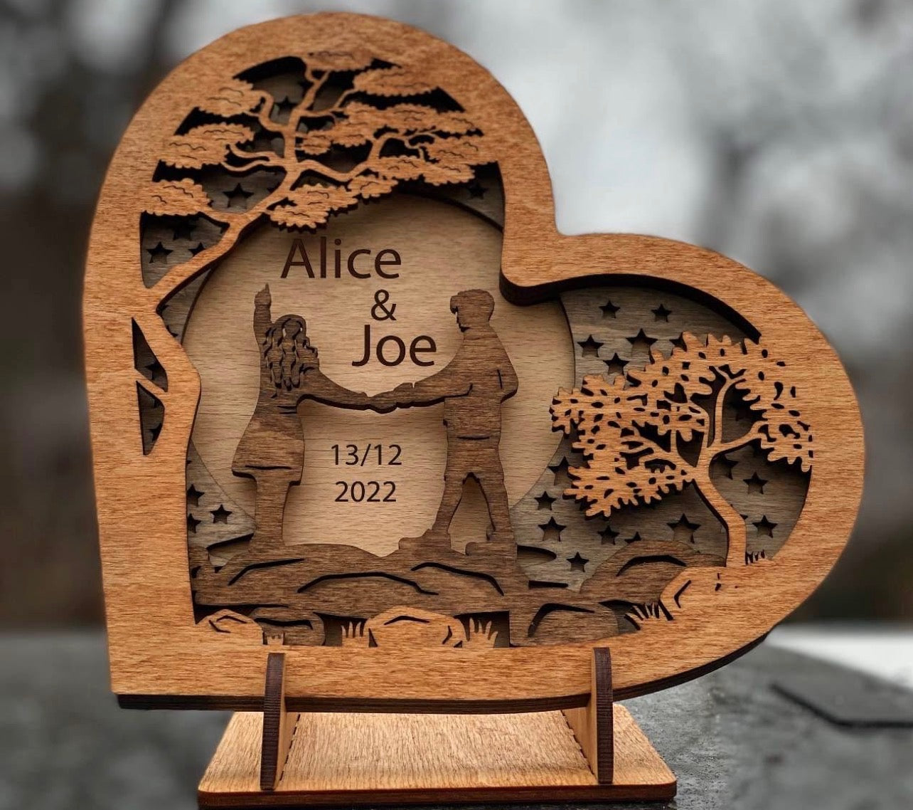 Wooden Heart with Couple on a River Stones