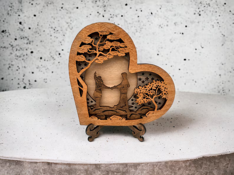 Wooden Heart with Couple on a River Stones