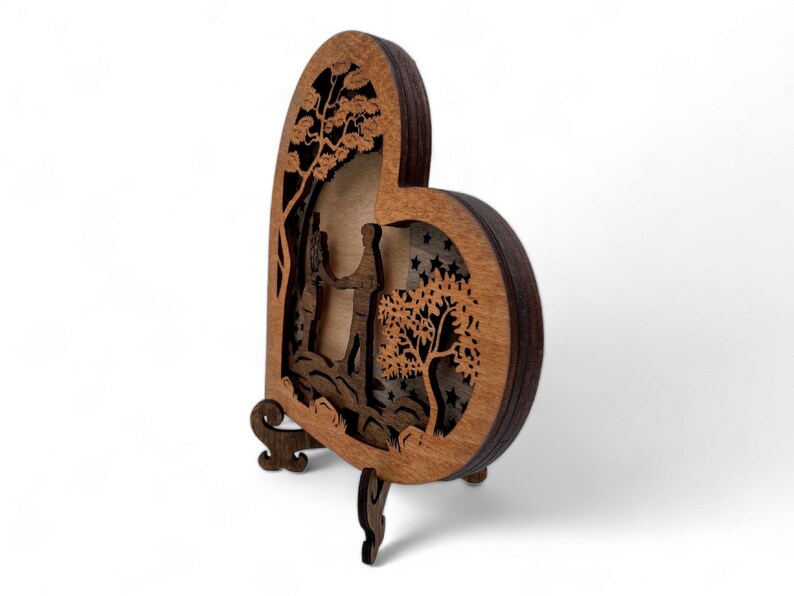 Wooden Heart with Couple on a River Stones