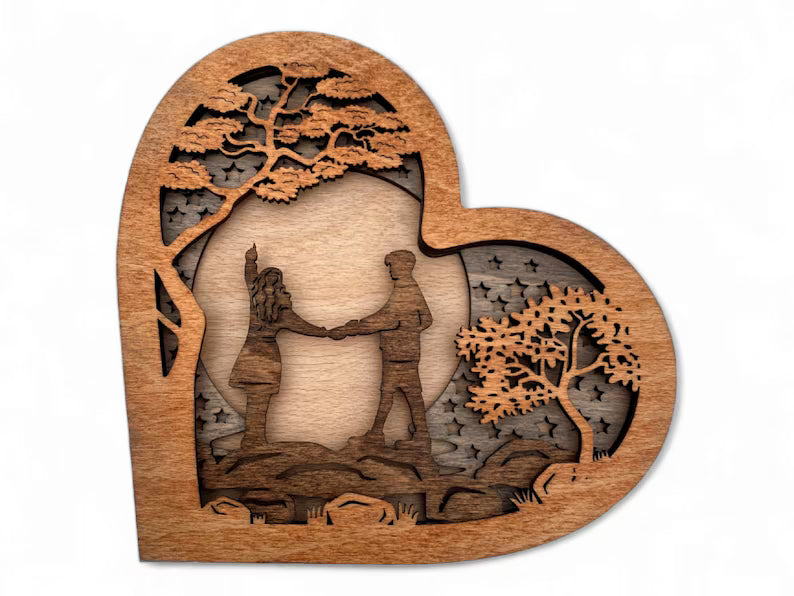 Wooden Heart with Couple on a River Stones