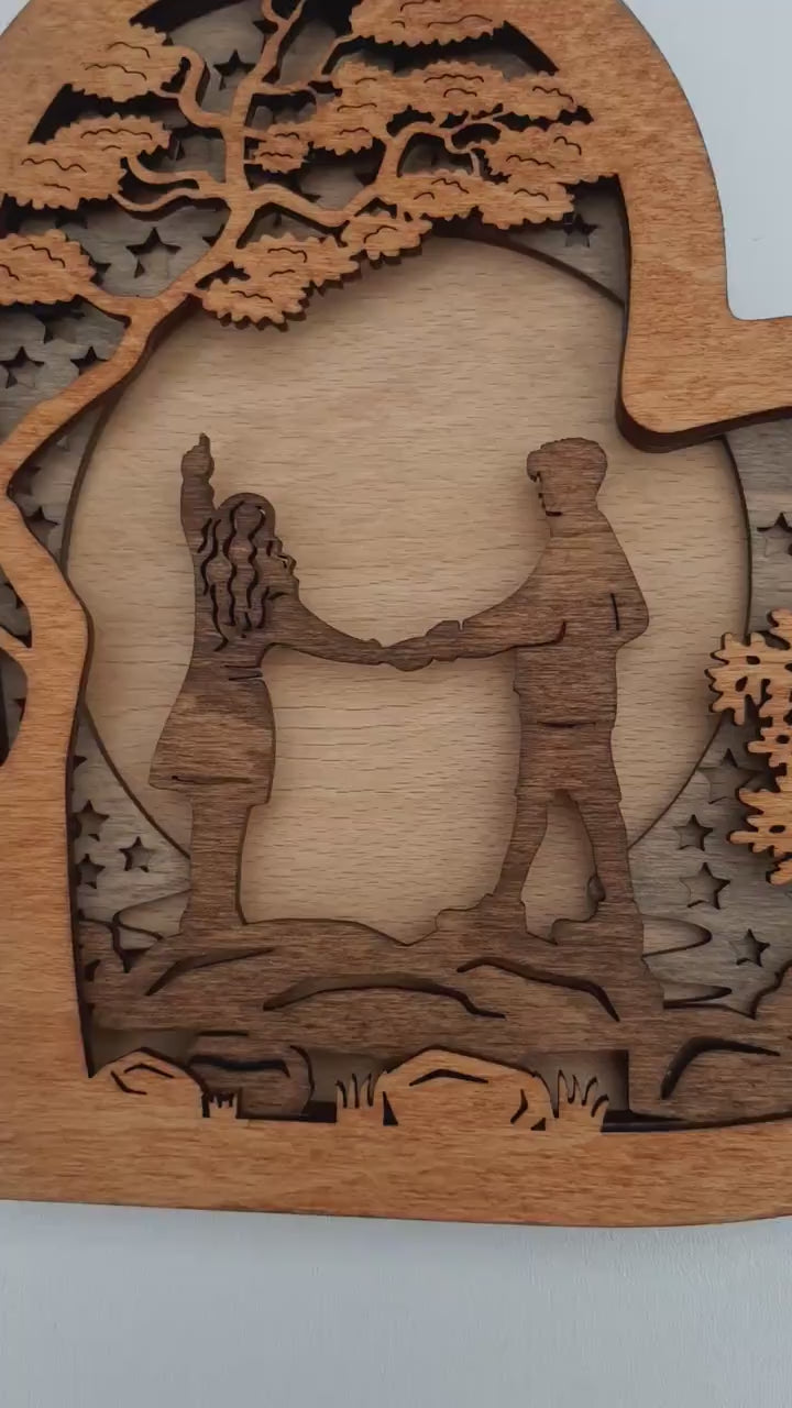 Wooden Heart with Couple on a River Stones